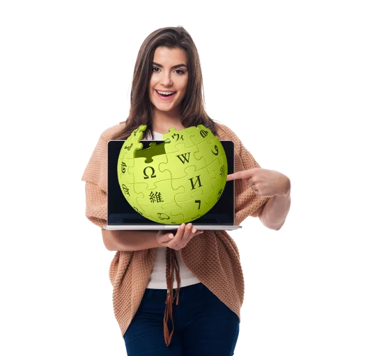 Woman holding a laptop displaying the Wikipedia logo, representing a professional Wikipedia page creation service